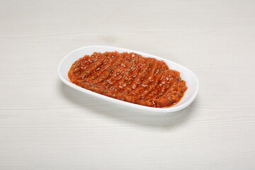 mashed salad with tomatoes, spices