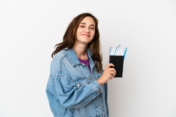 Fototapeta premium Young caucasian woman isolated on white background happy in vacation with passport and plane tickets
