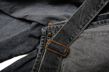 macro iron buckle on gray denim jumpsuit