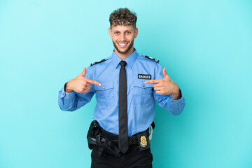 Young police blonde man isolated white on blue background proud and self-satisfied