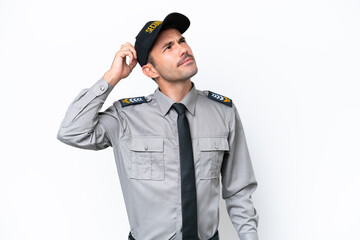 Young safeguard man over isolated white background having doubts and with confuse face expression