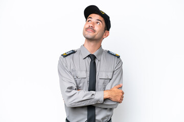 Young safeguard man over isolated white background looking up while smiling