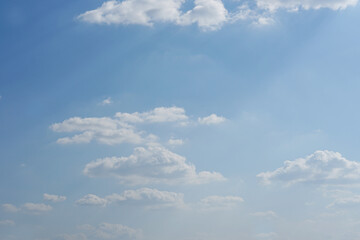 Blue sky with fluffy white clouds constantly changing shape.