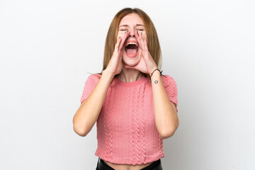 Young English woman isolated on white background shouting and announcing something