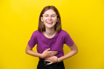 Young English woman isolated on yellow background smiling a lot
