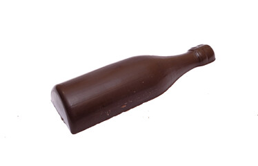bar of milk chocolate in the shape of a bottle on a white background