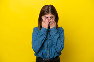 Young English woman isolated on yellow background with tired and sick expression