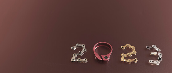Backgrounds of 2023 number with bike parts design on pink magenta background