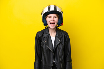 Young English woman with a motorcycle helmet isolated on yellow background with surprise facial expression