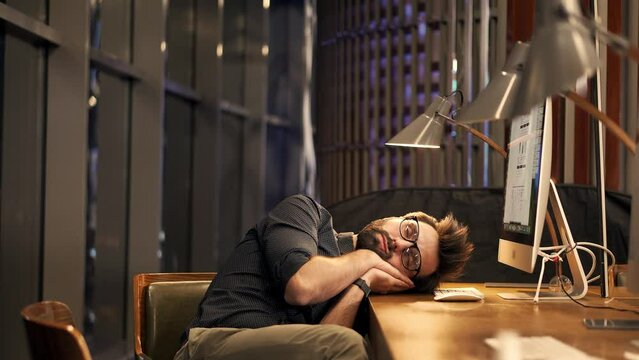 chronic fatigue entrepreneur take nap on desk  