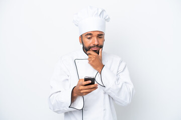 Young Brazilian chef man isolated on white background thinking and sending a message