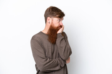 Redhead man with beard isolated on white background with tired and bored expression