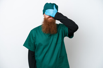 Surgeon redhead man in green uniform isolated on white background covering eyes by hands. Do not want to see something