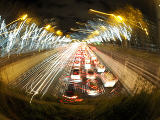 traffic jam in madrid castilla place at night with car lights tracks