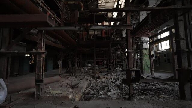 The interior of the destroyed production in the factory since the days of the Soviet Union. Dolly camera shot