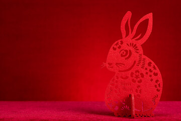 Chinese New Year of Rabbit mascot paper cut on red with copy space at horizontal composition no logo no trademark