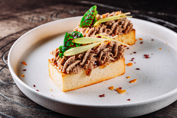 brioche with liver pate on plate