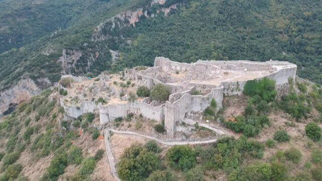 Aerial panoramic view of iconic Byzantine and medieval fortified despotate of Mystras on Mount Taygetus locaten near Sparti town, Laconia, Peloponnese, Greece