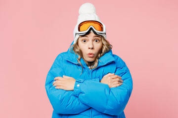 Snowboarder shocked sad woman wears blue suit goggles mask hat ski padded jacket hold herself...