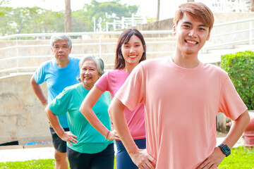 Portrait of a group of people exercising outdoors in the morning They smile happily. Sport concept,...