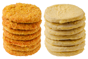 Stacks of semifinished chicken and fish cutlets
