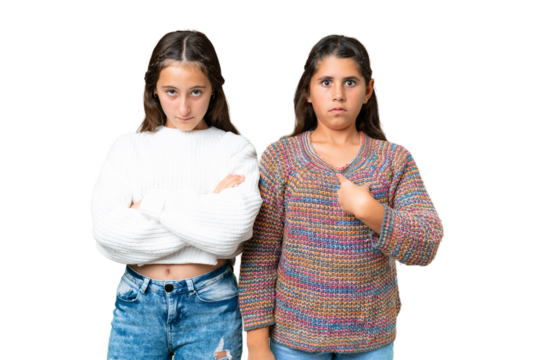 Friends girls over isolated chroma key background annoyed angry in furious gesture