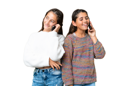 Friends girls over isolated chroma key background talking to mobile