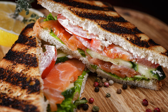 Sandwich with salmon, tomatoes, cucumber and spices