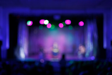 Plakat Texture blur and defocus, background for design. Stage light at a concert show. Artists perform on scene in light and smoke. 