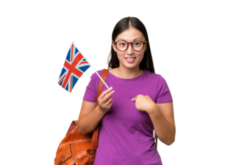 Young Asian woman holding an United Kingdom flag over isolated background with surprise facial expression