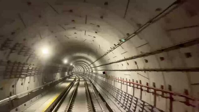 MRT Train rear view in a subway tunnel. Singapore MRT train in a subway rear view