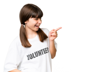 Little volunteer girl over isolated background pointing finger to the side and presenting a product