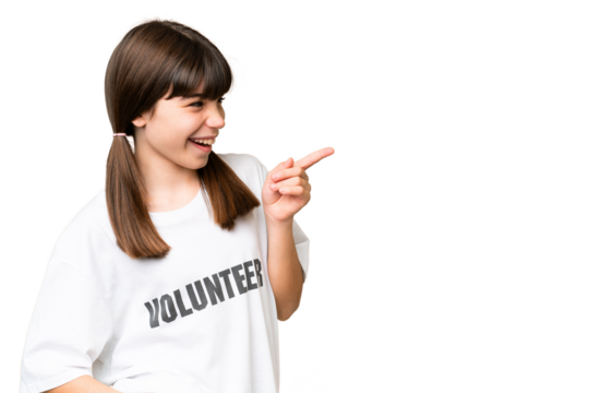 Little volunteer girl over isolated background pointing finger to the side and presenting a product