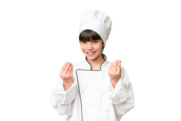 Little caucasian chef girl over isolated background making money gesture