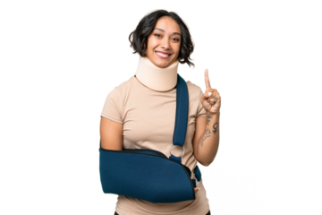 Young argentinian woman wearing neck brace and sling over isolated background pointing up a great idea