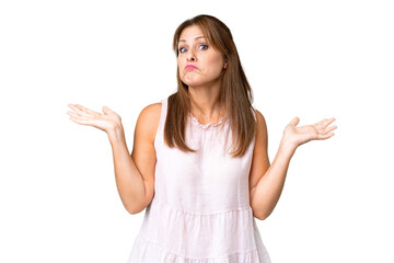 Middle age woman over isolated background making doubts gesture