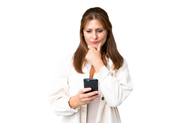 Fototapeta premium Middle age woman over isolated background thinking and sending a message