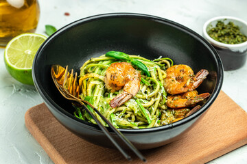 zucchini spaghetti with shrimp. Vegetarian vegetable low carb pasta, Restaurant menu, dieting, cookbook recipe top view