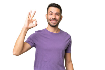 Young handsome caucasian man over isolated background showing ok sign with fingers
