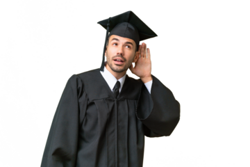 Young university graduate man over isolated background listening to something by putting hand on the ear