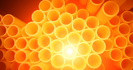 Background of the orange plastic pipes in stacked