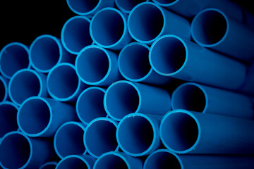 Background of the blue plastic pipes in stacked