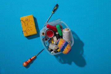 Box with sewing accessories and tools, top view