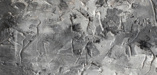 Grey and black textured wall. Abstract background. Rough putty wall pattern background. Panorama textured background in grey and white concrete