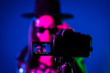 Backstage how operator working with professional camera. Videographer shoots music clip with...