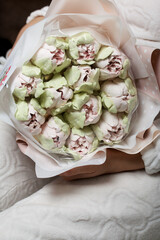 Marshmallow bouquet. Zephyr tulips. Natural homemade marshmallow. Packed in paper in the form of a...