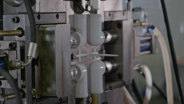 Injection molding machine for plastic products during operation. Technology for the production of plastic products from polypropylene.