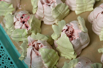 Zephyr tulips. Natural homemade marshmallow. Arranged on a tray. Close-up.