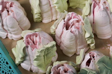 Zephyr tulips. Natural homemade marshmallow. Arranged on a tray. Close-up.