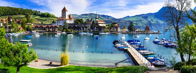 Gordijnen Scenic lake Thun and the Spiez village with its famous medieval castle and old town in the alps in Canton Bern in Switzerland © Freesurf